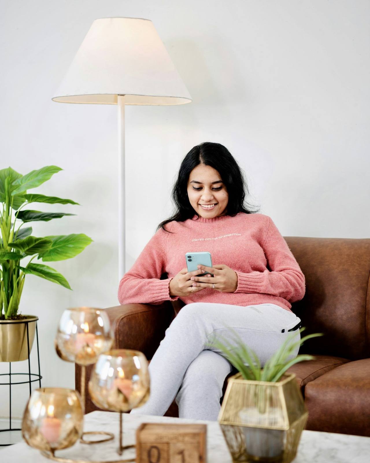 Creator relaxing while phone shows notifications